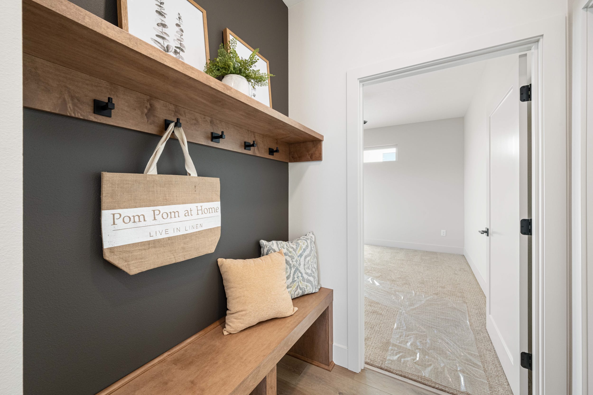 Cozy mudroom with bench and wall hooks.