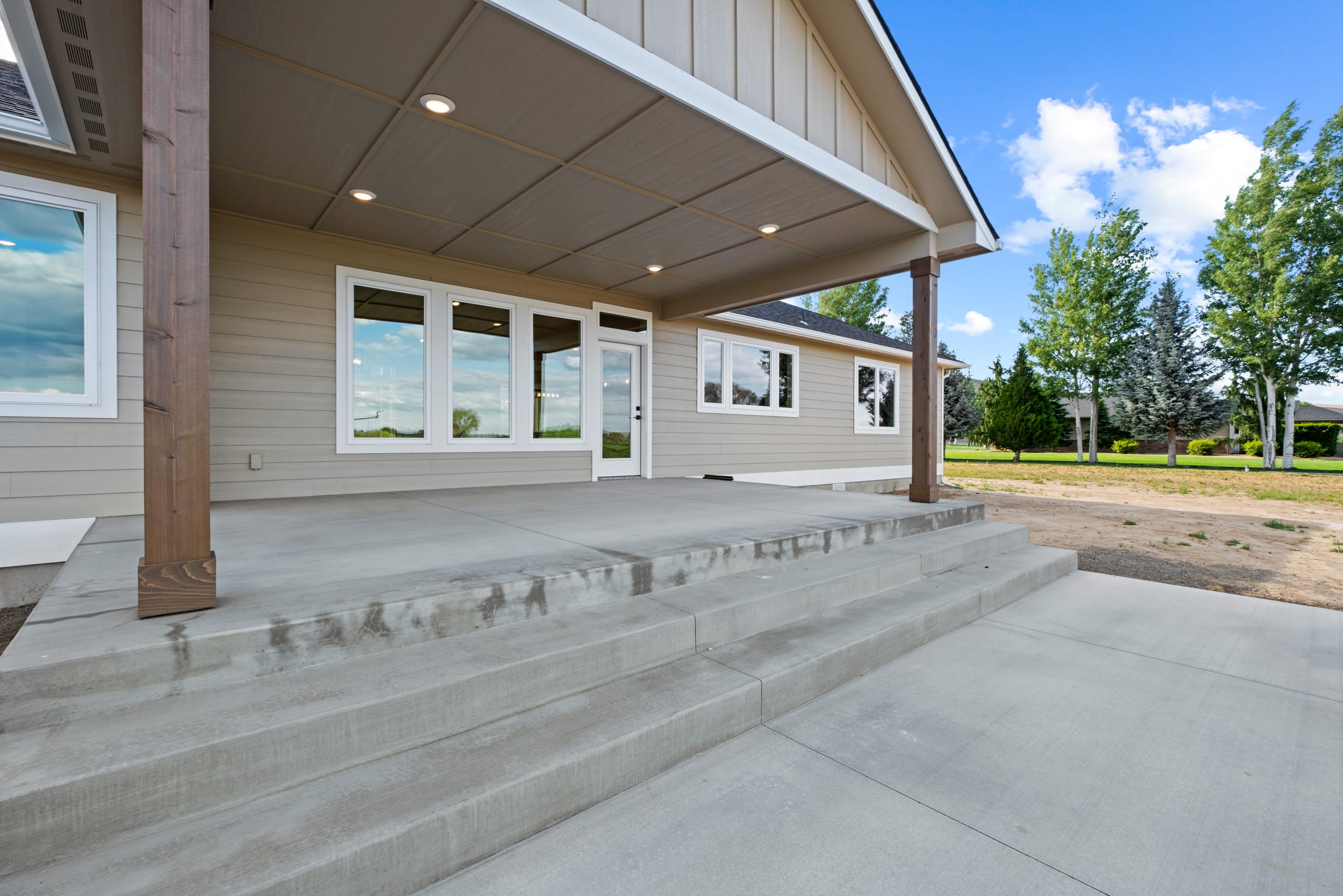 Modern home with spacious concrete patio