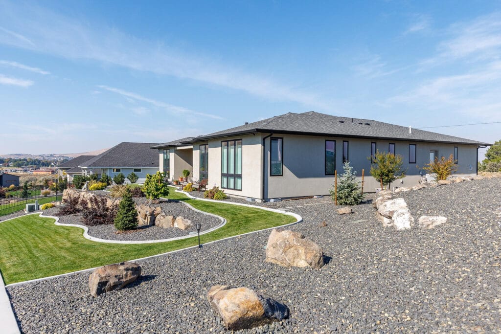 Modern house with landscaped rock garden.