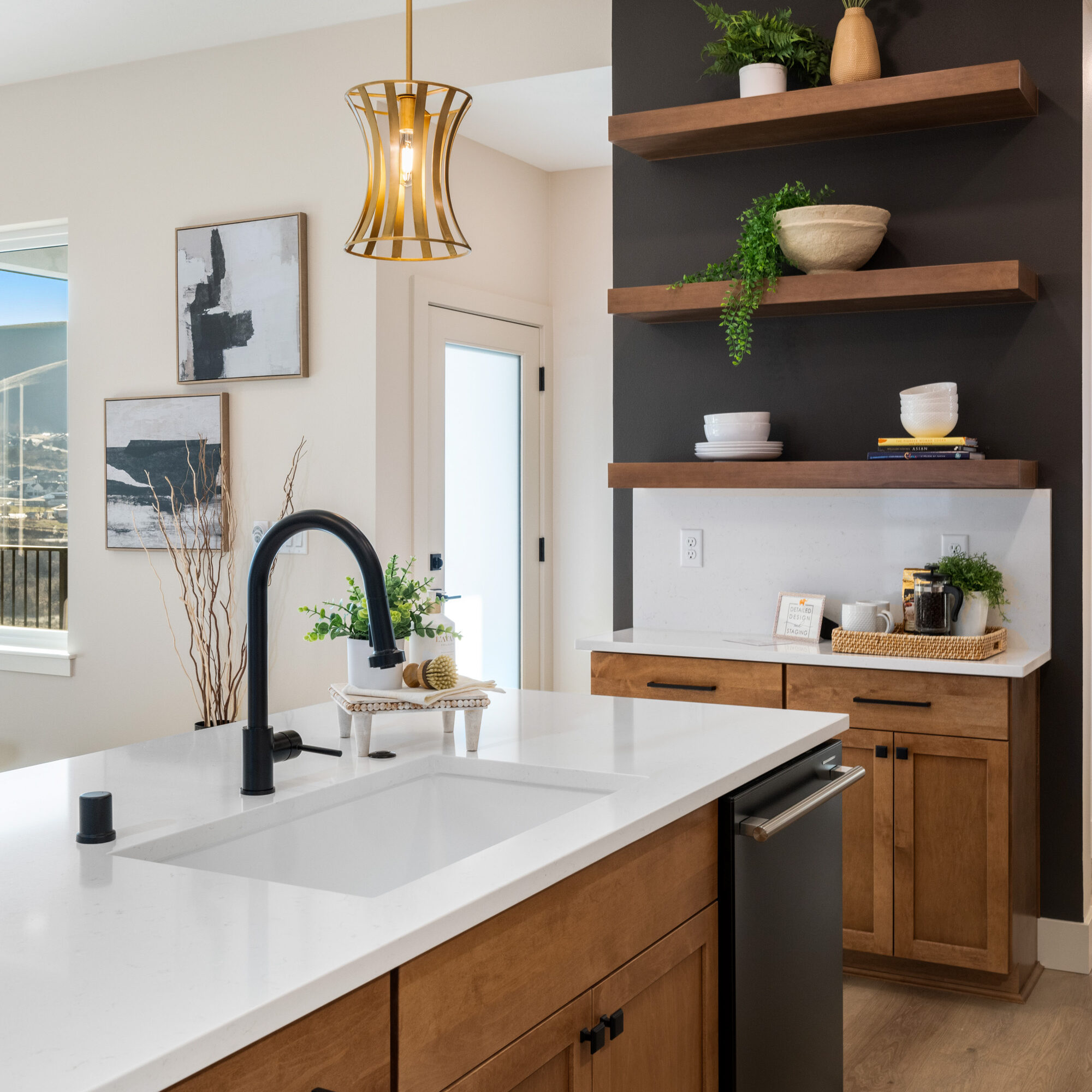 Modern kitchen with wooden cabinets and shelves.